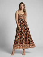Marbella | Blomstret Maxi Kjole Med Slids Og Smock Overdel