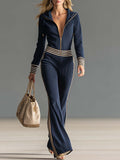 Sienna | Dame Retro sporty mørkeblå strikjumpsuit med hætte, lynlås og V-udskæring