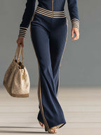 Sienna | Dame Retro sporty mørkeblå strikjumpsuit med hætte, lynlås og V-udskæring
