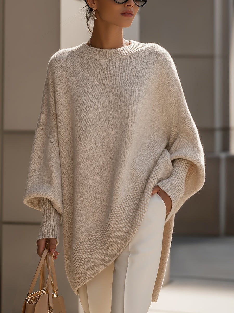 Dame oversize striktrøje med rund hals og asymmetrisk kant