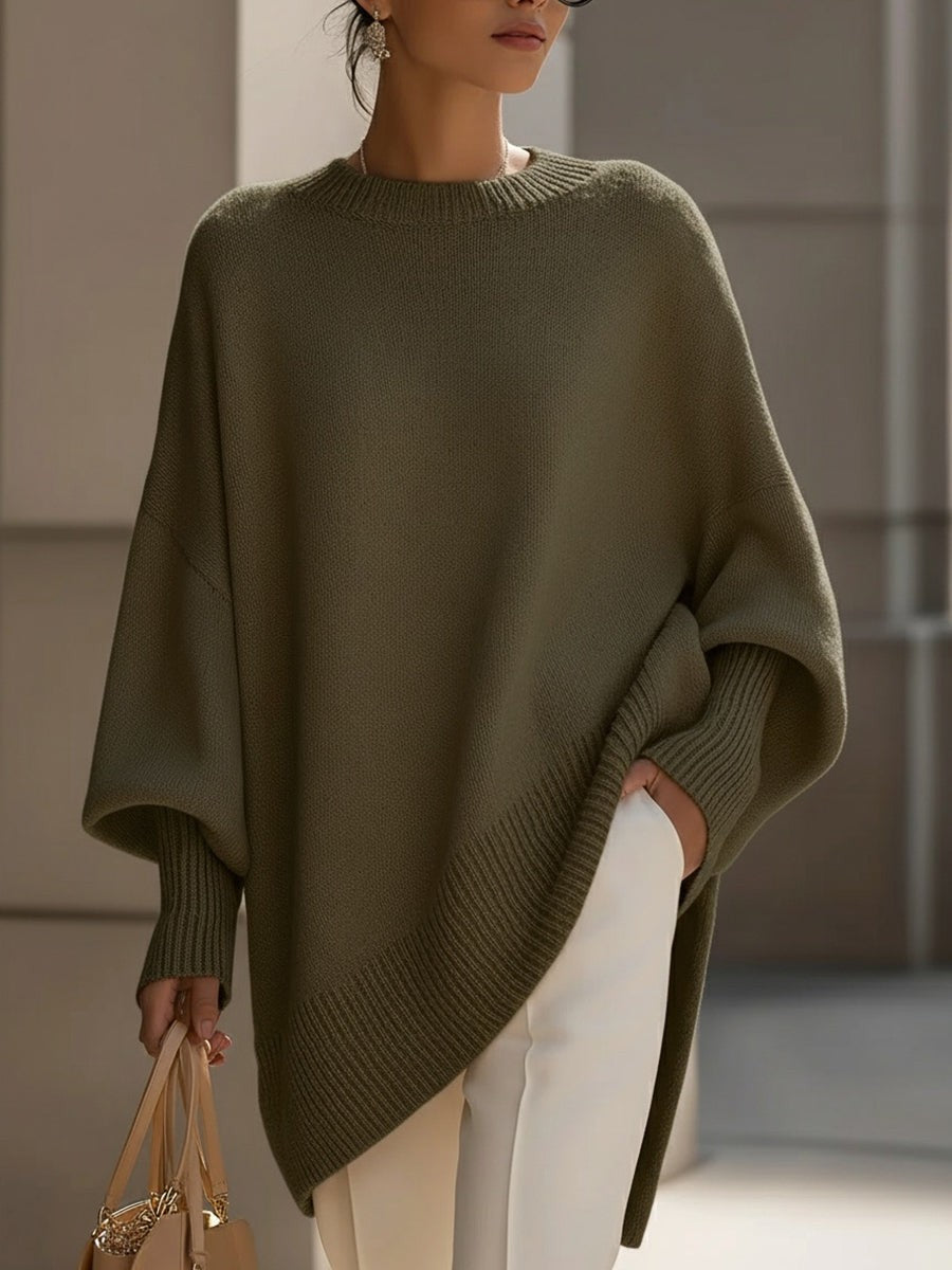 Dame oversize striktrøje med rund hals og asymmetrisk kant