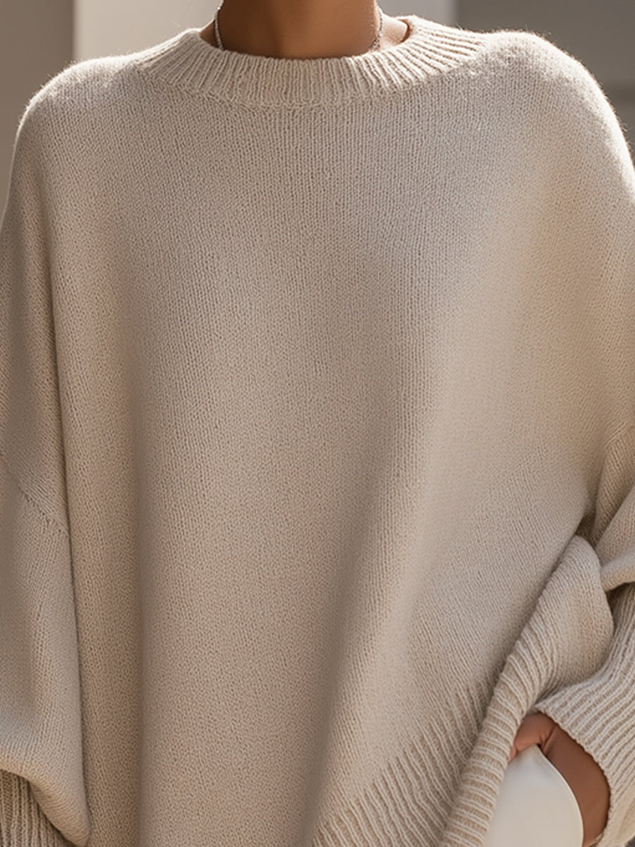 Dame oversize striktrøje med rund hals og asymmetrisk kant