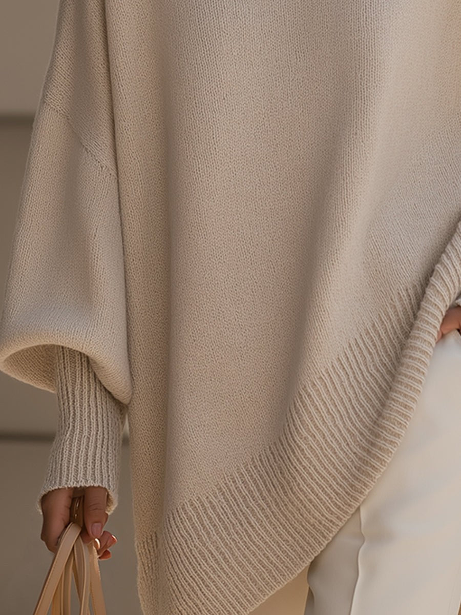 Dame oversize striktrøje med rund hals og asymmetrisk kant