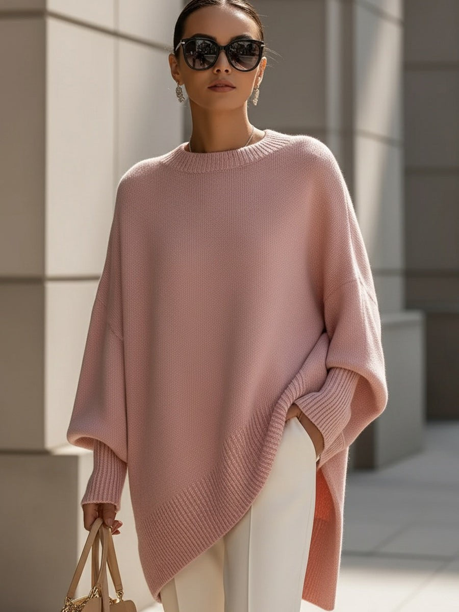 Dame oversize striktrøje med rund hals og asymmetrisk kant