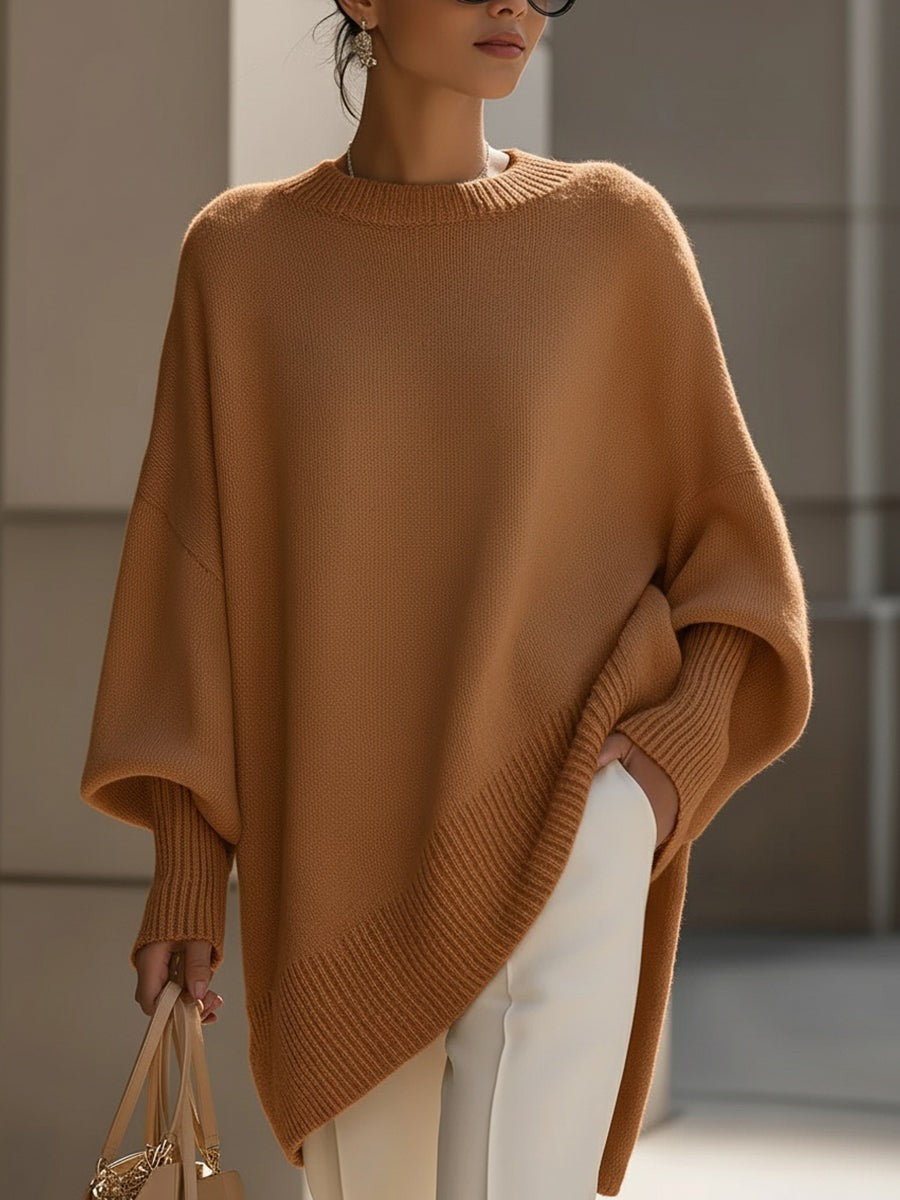 Dame oversize striktrøje med rund hals og asymmetrisk kant
