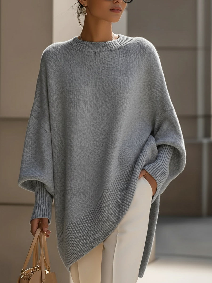 Dame oversize striktrøje med rund hals og asymmetrisk kant